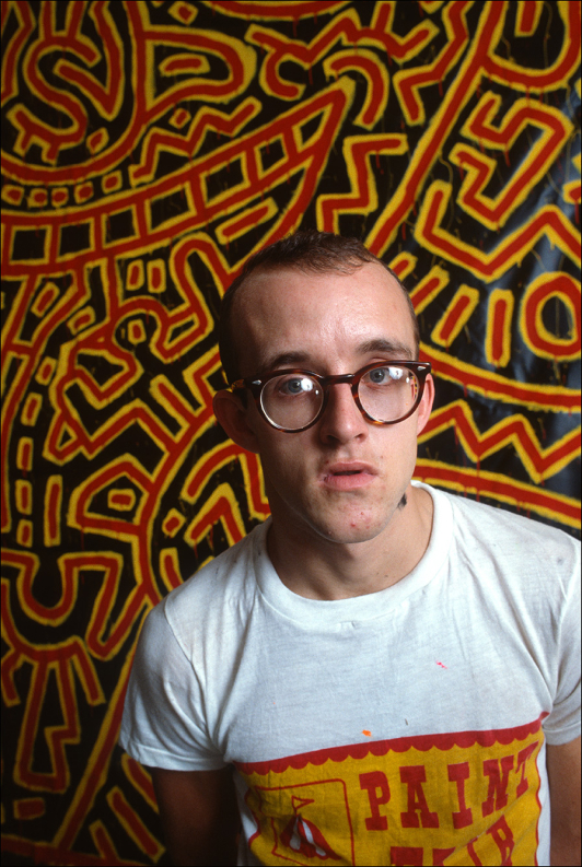 Keith Haring paints an orange mural with figures